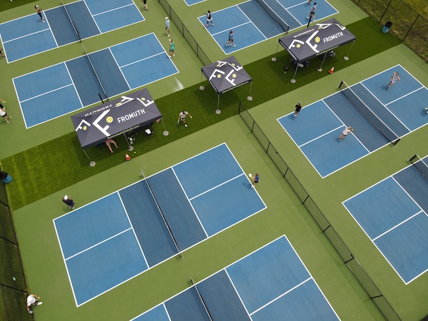 An aerial view of mightyTENT pop-up tents used at a pickleball tournament.
